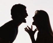 Silhouette of man and woman yelling at each other