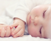 close-up portrait of a beautiful sleeping baby on white,close-up portrait of a beautiful sleeping baby on white