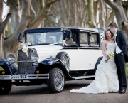 bride-and-groom-with-wedding-car