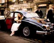 bride-steps-out-of-classic-car-1140x765