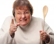 Upset Senior Woman with The Wooden Spoon Isolate