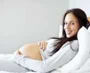 Young pregnant lady lying comfortably on the bed